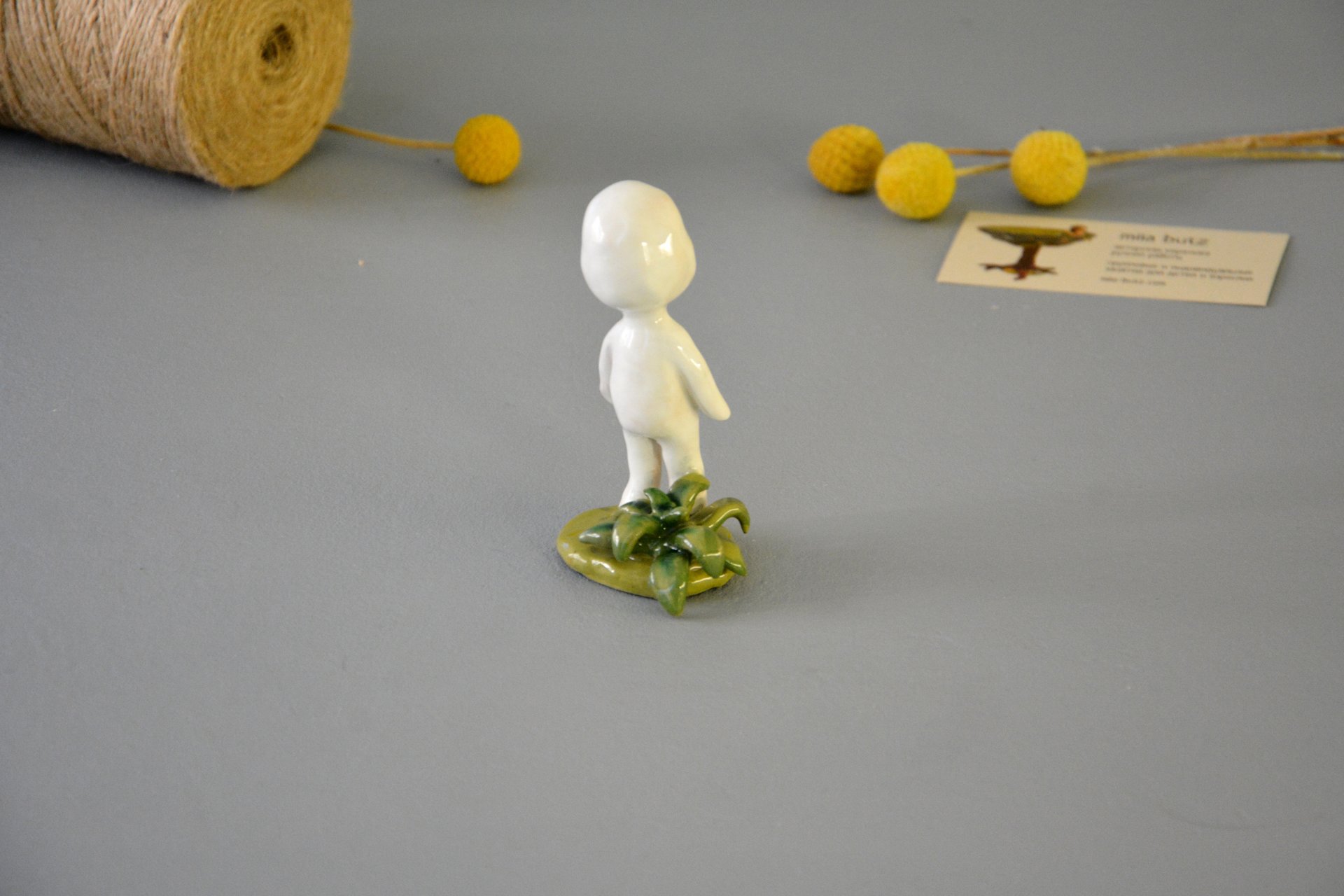 A figurine of a smiling Kodama tree spirit, height - 9.5 cm, photo 5 of 7.