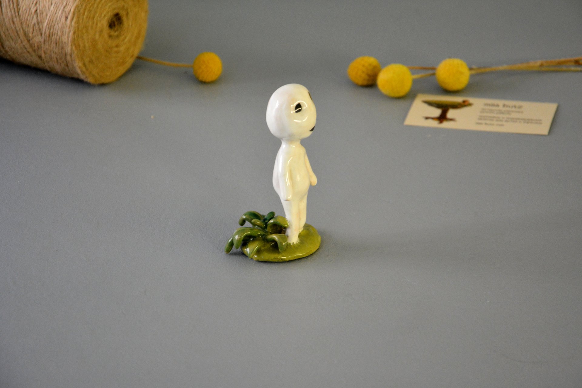 A figurine of a smiling Kodama tree spirit, height - 9.5 cm, photo 6 of 7.