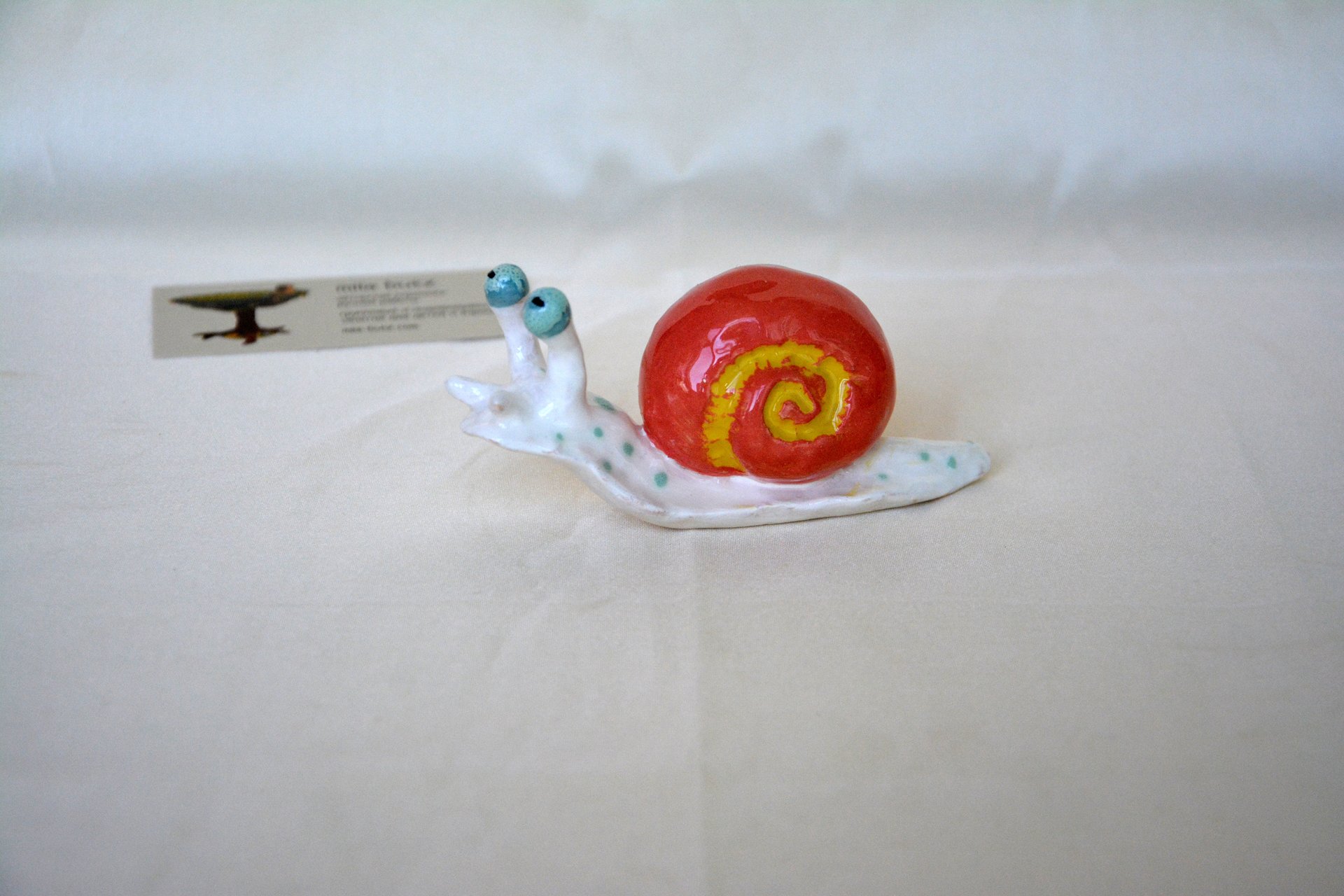 The figurine of a Cochlea is red-white, height - 4 cm, photo 2 of 6.