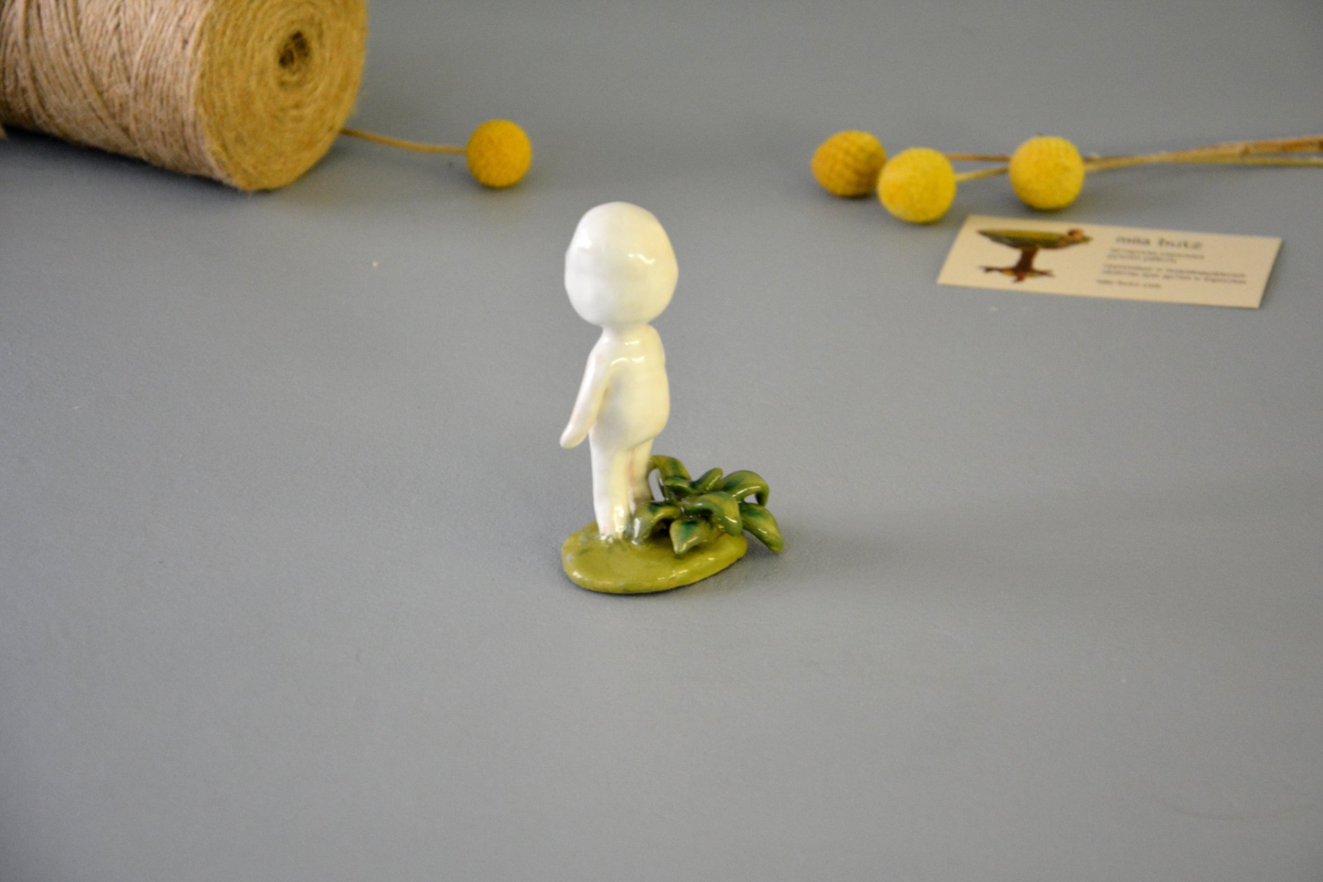 A figurine of a smiling Kodama tree spirit, height - 9.5 cm, photo 4 of 7.